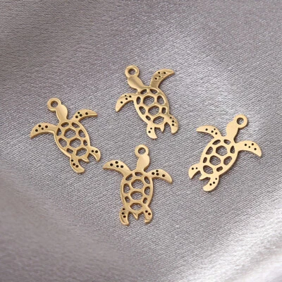 Colgantes de plata con dijes de tortuga pulidos en oro de 20 piezas para hacer joyas Foto 1 de 3