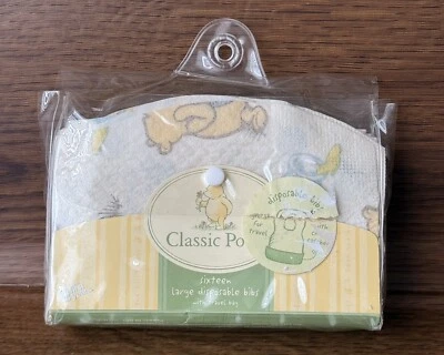 14 baberos de papel desechables grandes clásicos Pooh con bolsa de viaje de plástico Foto 1 de 4