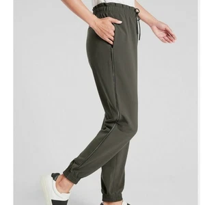 ATHLETA Metropolis Jogger Pants Primatwill Olive Satin Piping Pockets NWOT sz 14 - Picture 1 of 11