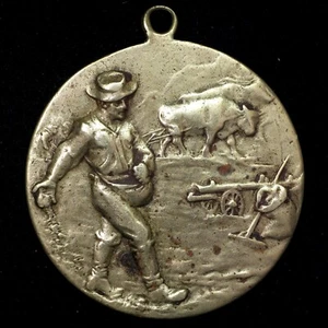 Farmer Planting Seeds with Oxen Pulling Plough Behind Agricultural Medal 28mm - Picture 1 of 2