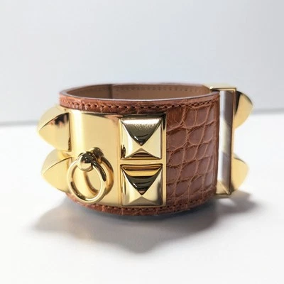 Brazalete Brazalete HERMES Collier de Chien Cuero Tono Naranja/Dorado Envoltura de Lujo Foto 1 de 4