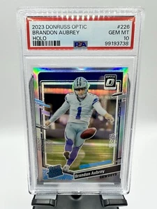 2023 Donruss Optic Brandon Aubrey Holo PSA 10 (RC) - Picture 1 of 2