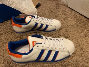 orange adidas superstar