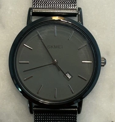 Reloj SKMEI Unisex Gris Malla Metálica Fecha Ajustable - Caja 33 mm Foto 1 de 4