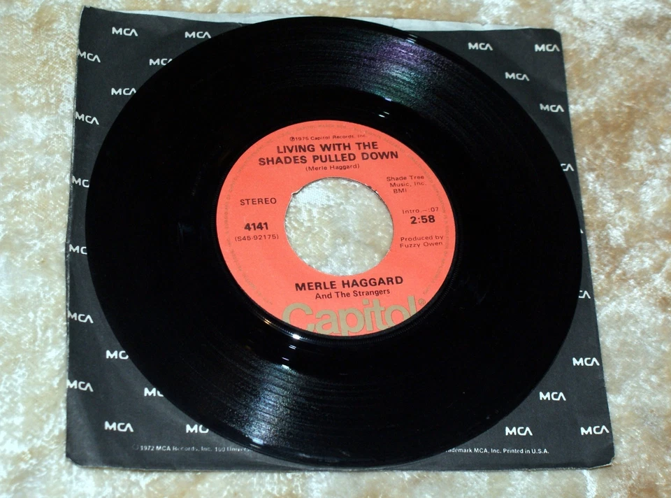 Merle Haggard 45rpm Record , Living With The Shades Pulled Down/All In The Moves - Image 1 of 2