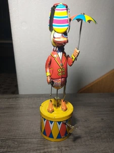 Vintage Blechspielzeug tanzende Ente auf Trommel mit Regenschirm funktioniert  - Bild 1 von 5