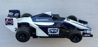 Трассовая автомодель AFX TOMY SUPER-G+ 2005 IndyCar No2 CASTROL Fed-Ex AFX Racing NAV/WHT HO - Изображение 1 из 4