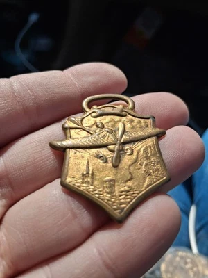 Emblema escudo latón/bronce vintage - diseño de canoa y paleta con lazo Foto 1 de 3