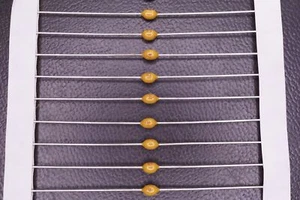 Lot of 50 A104K15X7RF5TAA Vishay Ceramic Capacitor 0.1uF 10% 50V X7R Axial NOS - Picture 1 of 2