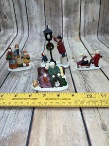 Christmas Village Figurines Lot of 4 elderly kids sled family unbranded holiday - Picture 1 of 22
