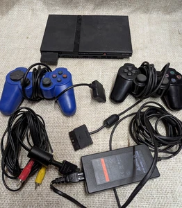 Sony PlayStation 2 Slim with 9 Games, 2 Controllers + Buzz Game & controllers - Picture 1 of 12