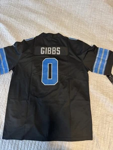 Jersey Jahmyr Gibbs Lions negro y azul para hombre talla XL NUEVO - Imagen 1 de 8
