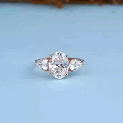 2TCW Oval & Pear Cut IGI Certified Lab Grown Diamond 3-Stone Ring 14kt Rose Gold - Image 1 of 4