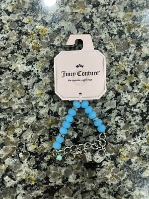 Pulsera elástica azul JUICY COUTURE con cuentas, cerradura, estrella, escudo, encanto Foto 1 de 2