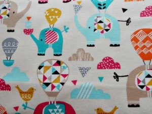  Jersey Elefanten türkis bunt auf creme weiß Meterware Baumwolljersey  - Bild 1 von 3