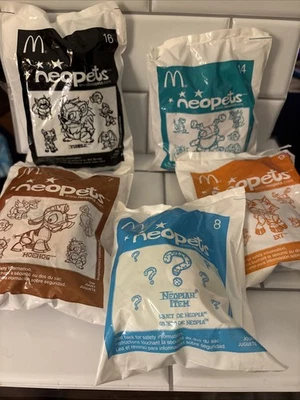Lot 5 Sealed McDonald's 2004 Neopets 7 Moehog 8 Item ? 9 IXI 14 Grundo 16 Yurble - Image 1 of 4