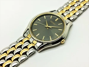 SEIKO MEN'S V701-7A39 VINTAGE NOT-WORKING DRESS QUARTZ ANALOG WATCH SFWD57 - Picture 1 of 5