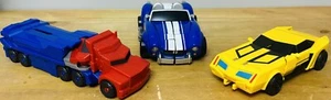 3 Transformers: Titan Changers Optimus Prime, 3 Step Changers Bumblebee + 1 weitere - Bild 1 von 23