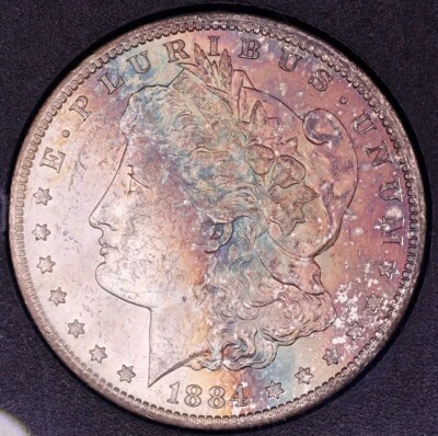 Dólar de plata Morgan 1884-CC tesoro GSA NGC MS63 - bellamente tono arco iris Foto 1 de 4