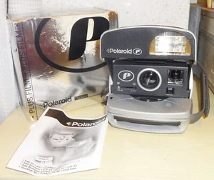 FLASH INCORPORATO FOTOCAMERA ISTANTANEA POLAROID 'P' 600 ARGENTO + SCATOLA ORIGINALE + MANUALE - Foto 1 di 8