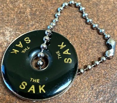 DISCO/LLAVERO MONEDERO SAK VINTAGE CON CADENA BOLA ORIGINAL Foto 1 de 3