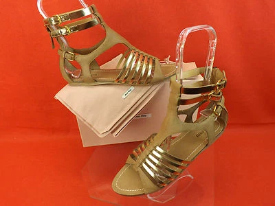 NUEVO EN CAJA SANDALIAS PLANAS MIU MIU PRADA CUERO DORADO CAMEL CREMALLERA TRASERA GLADIADOR 35.5 5 Foto 1 de 4