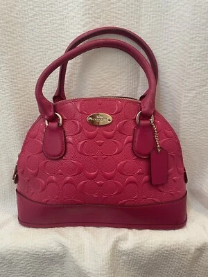 Auténtico bolso Coach Mini Cora rosa abovedado Foto 1 de 4