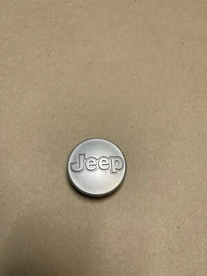 Tapacubos central llanta OEM 885PA66 Jeep Cherokee XJ y Wrangler TJ 1997-2006  Foto 1 de 2