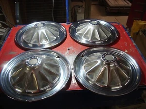 AMC hub caps, set of 4. Every one of them has some kind of curb bumps. See pic's - Picture 1 of 11