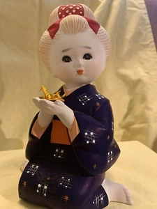 Japanese Girl Holding Origami Bird - Picture 1 of 3