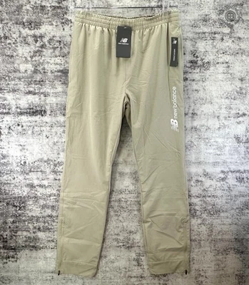 NUEVO CON ETIQUETAS - Pantalones New Balance All Motion Forrados de Malla Elástica Beige Claro - Pequeños para Hombre Foto 1 de 4