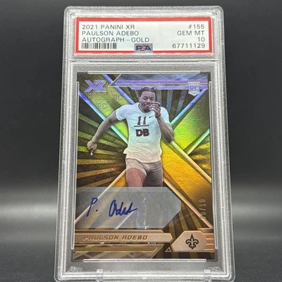 PAULSON ADEBO 2021 PANINI XR #155 RC ROOKIE AUTO GOLD /10 PSA 10 - Saints/Giants - Image 1 of 4