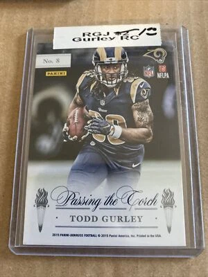 2015 Donruss #8 Marshall Faulk Todd Gurley Passing the Torch Elite Inserts Rams - Image 1 of 2