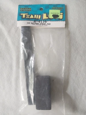 Team Losi  XXX Battery Strap Hold Down Graphite #A-4116with Foam - Image 1 of 2
