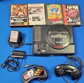 Sega Genesis Model 1601 Model 1 Console with 4 games, adaptors, and controllers