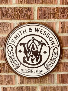 Smith & Wesson - Round HOME / GARAGE TIN SIGN Vintage logo gun ammo 11.75”Dia. - Picture 1 of 4