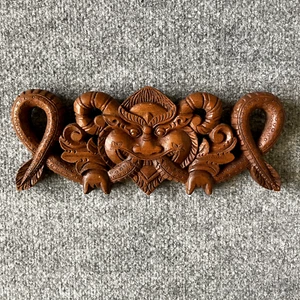 A Nepalese style carved wood panel H: 4 5/8, W: 11 3/8, D: 3/4 in. - Picture 1 of 8