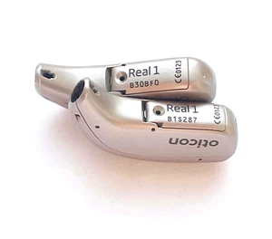 Usato, 2x Oticon Real 1 Colore Beige + con Caricabatterie + 2 Nuove, Batteria Z22a + Altoparlanti - Foto 1 di 8