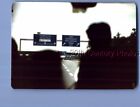 FOUND COLOR PHOTO E_4167 DARK ABSTRACT FROM CAR OVER FREEWAY,SIGNS