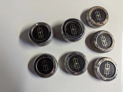 Juego de 7 tapas centrales de rueda Oldsmobile Cutlass Calais Rally 1985-1986 OEM Foto 1 de 4