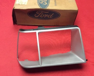 NOS 1981-1987 FORD ESCORT MERCURY LYNX PASSENGER HEADLIGHT CORNER BEZEL - Image 1 of 4