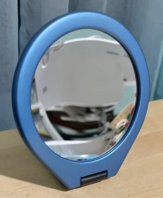 SMALL BLUE COMPACT TRAVEL MIRROR BY MARIANNA 2 SIDED 5 3/8” DIAMETER - Image 1 of 3