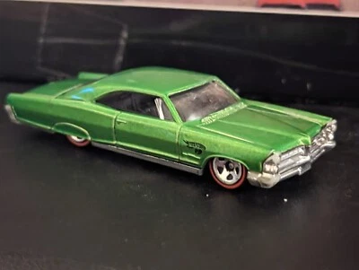 EXTRAORDINARY 1965 PONTIAC BONNEVILLE EMERALD GREEN WITH RED SIDEWALLS BY HW - Image 1 of 4