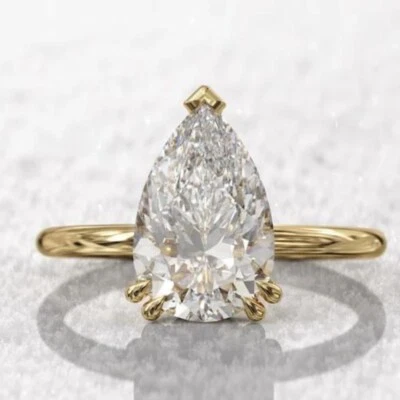 Anillo de compromiso halo oculto moissanita corte pera oro amarillo de 10 quilates Foto 1 de 4