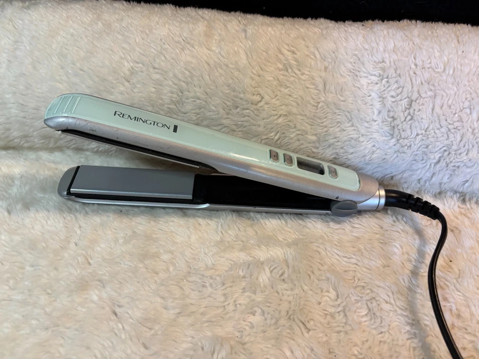 Plancha plana digital de cerámica hidratante y acondicionadora Remington Shine Therapy de 1" Foto 1 de 2