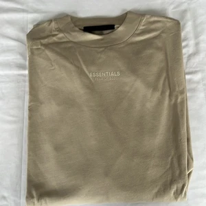 Camiseta Fear of God Essentials manga larga para hombre en nube plateada talla M nueva con etiquetas - Imagen 1 de 7