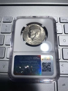 1776-1976 D Kennedy Bicentennial Half Dollar. Reverse Die Break On Rim. NGC MS64 - Picture 1 of 2