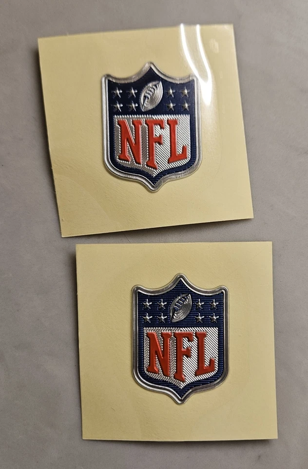 2 NFL Silver Vapor Untouchable Shield Plastic Jersey Football Patches Sew only - Image 1 of 4