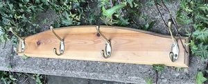 WALL MOUNTED METAL BRASS FINISH COAT HOOKS MOUNTED ON PINE BACKBOARD - Picture 1 of 2