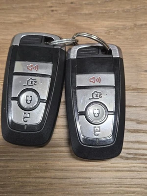 Lot of 2 Used Ford Mustang Smart Keys.  Keys are cut. - Image 1 of 2
